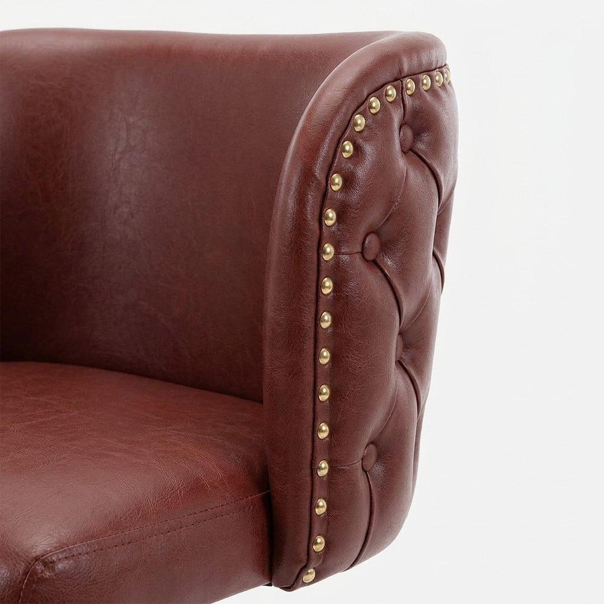Button-tufted outer back with a row of domed gold nailheads