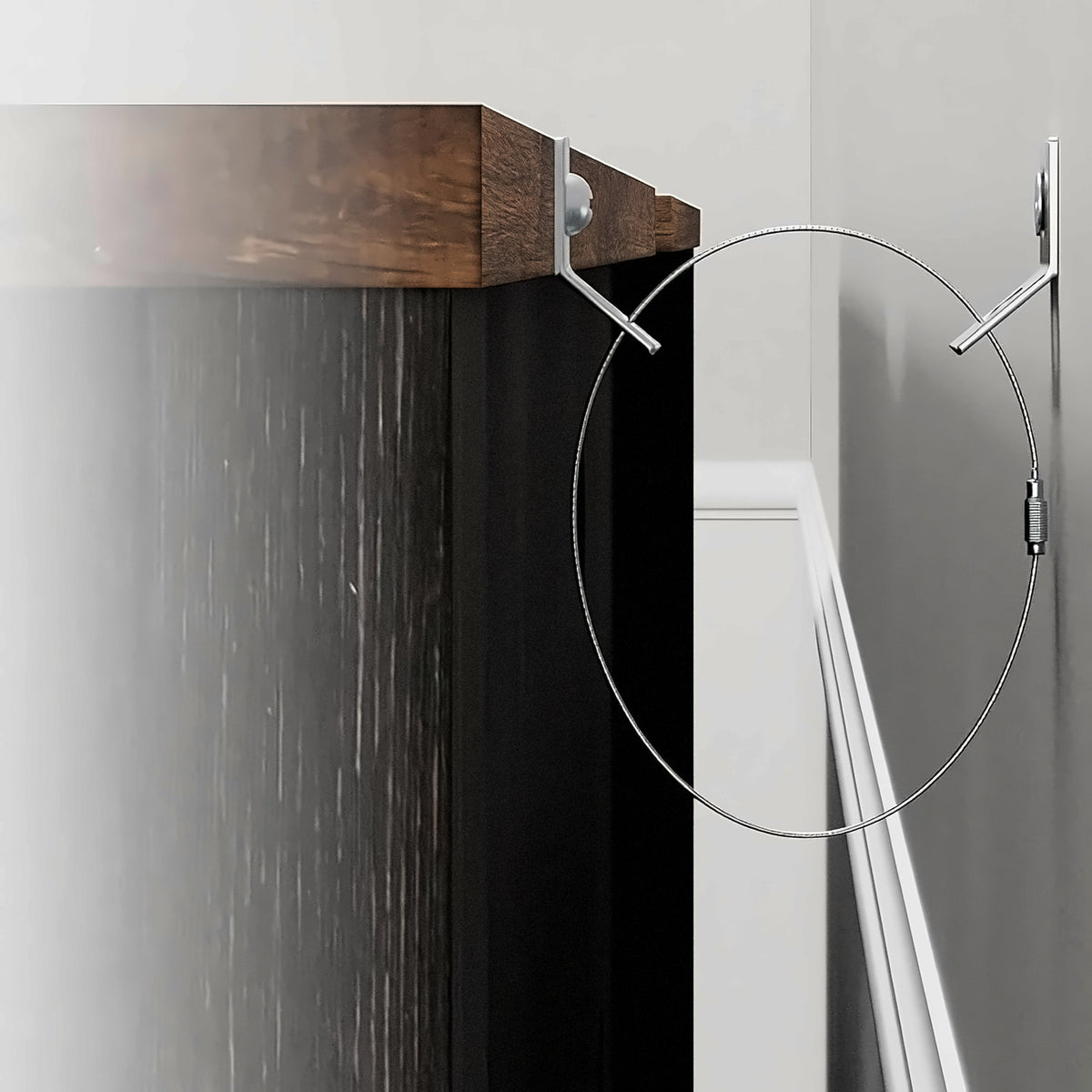 Anti-tip wire loop and brackets at the back top edge of the 100 inch tv stand (close-up detail)