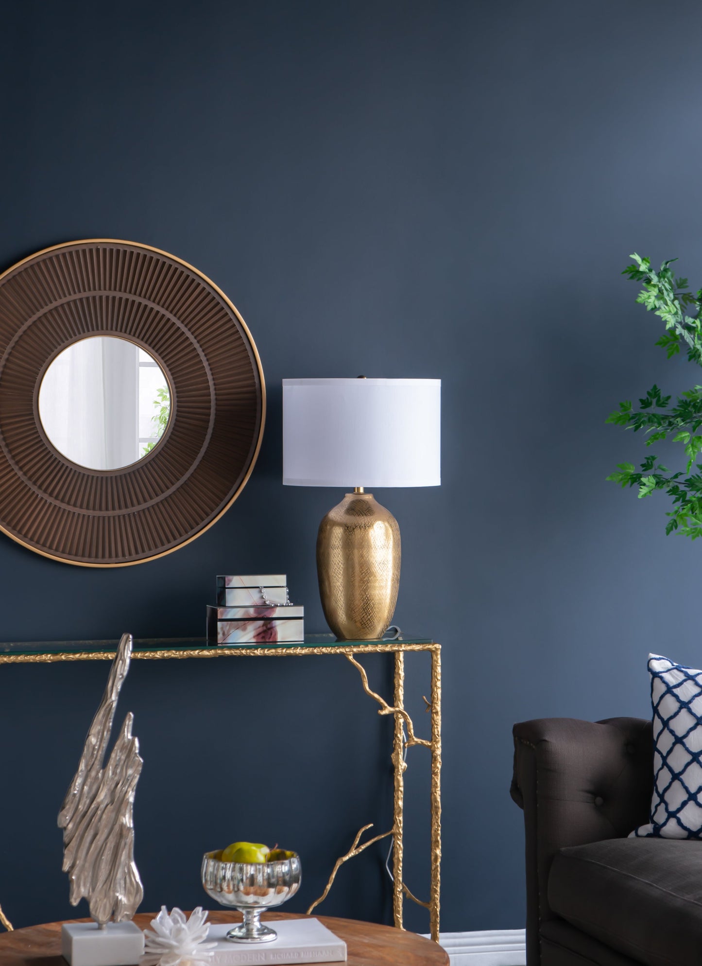 Decorative interior setting with Aluminum Table Lamp With a White Fabric Shade, and dark blue wall.