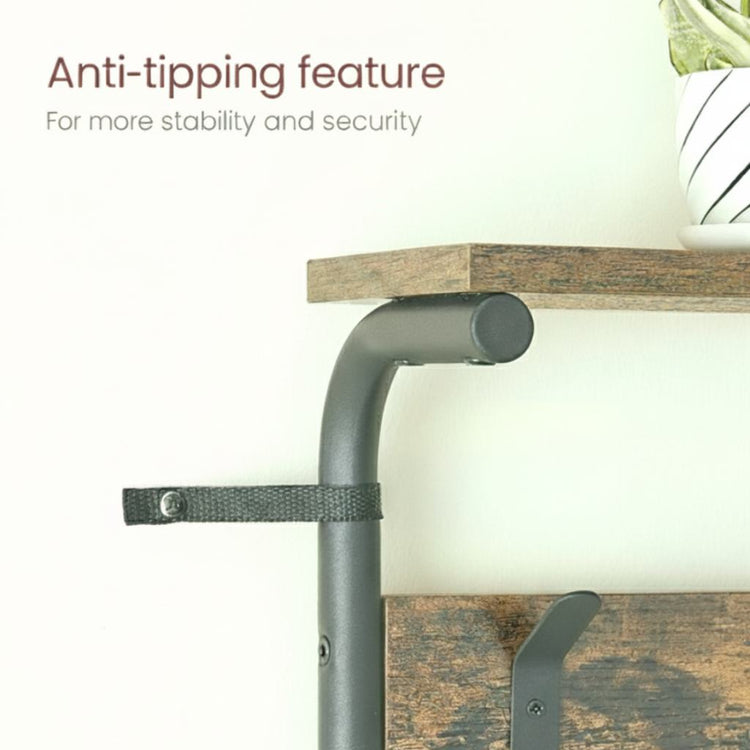 Anti-tipping feature on a piece of furniture with a wooden shelf and metal support.