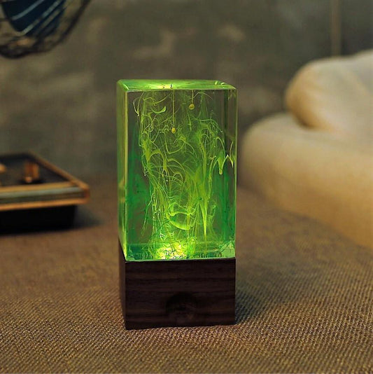 Rectangular eplight resin green glowing table on a textured surface