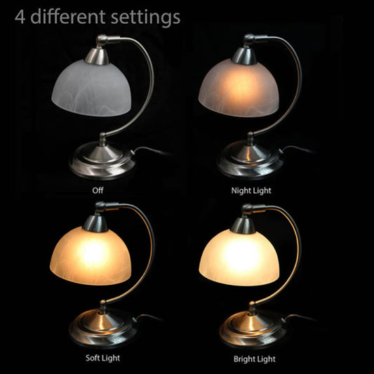 Table lamp with four different light settings on a black background
