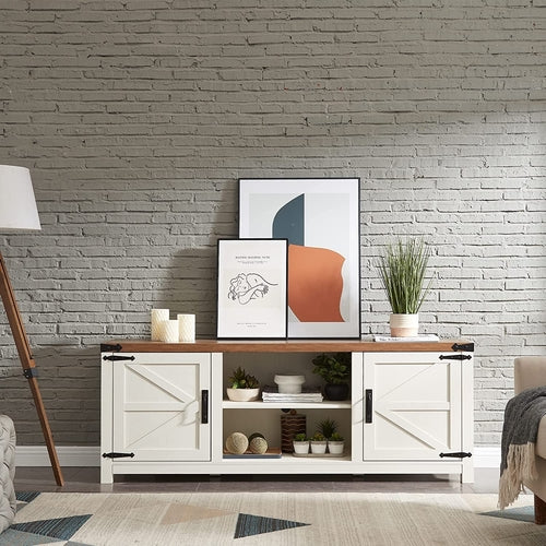 White entertainment console with wooden top against a brick wall