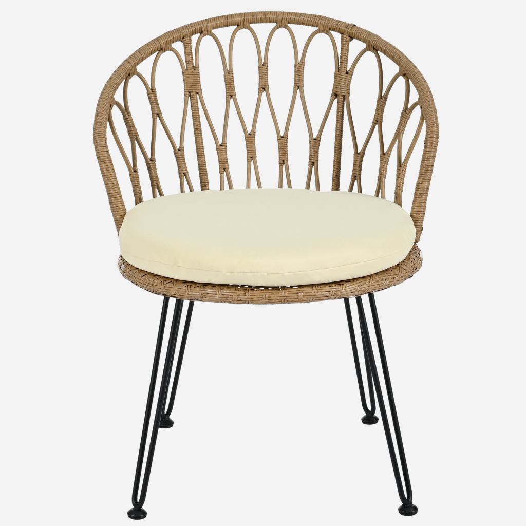 Wicker chair with a cream cushion on a white background