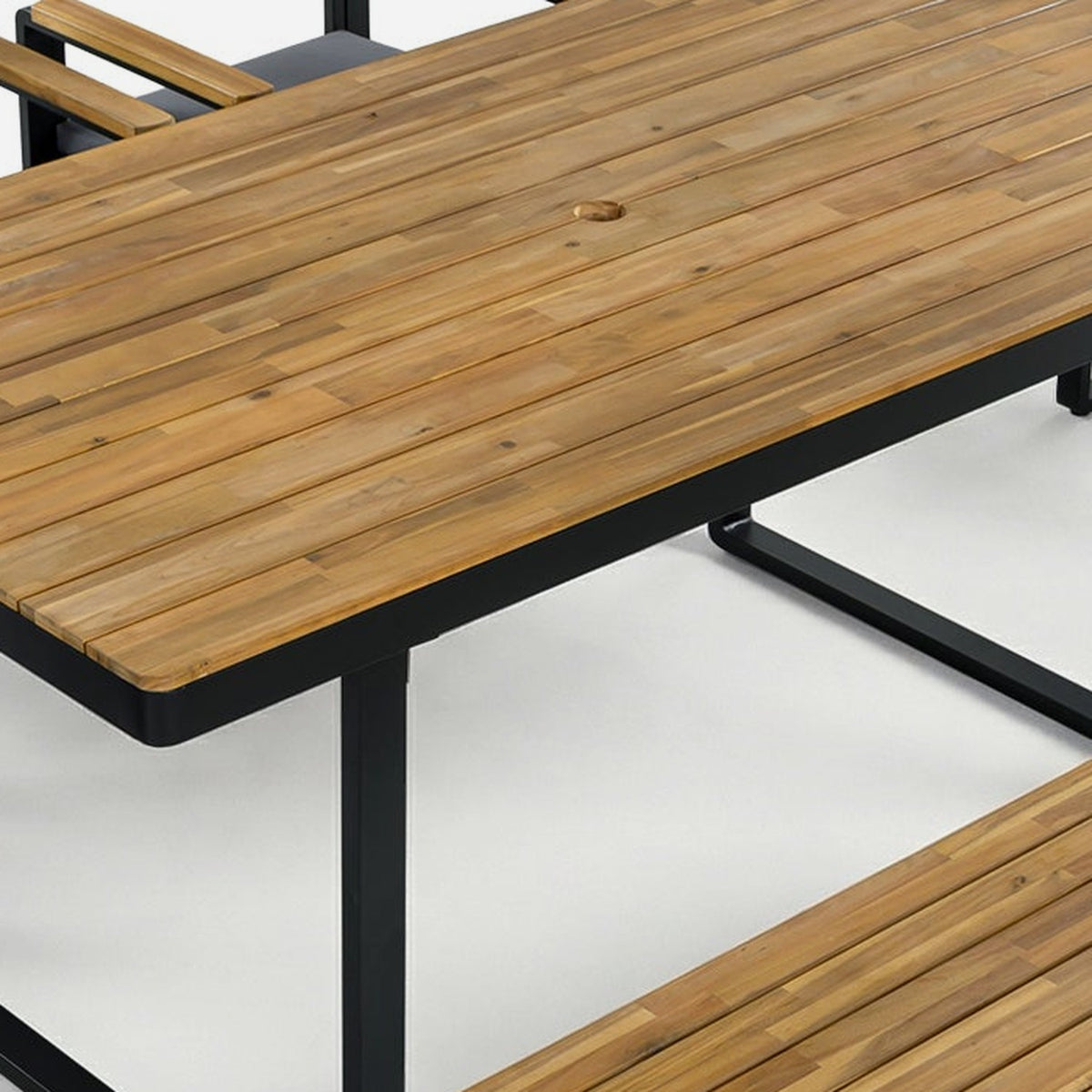 close-up of the solid acacia slatted tabletop with its umbrella hole