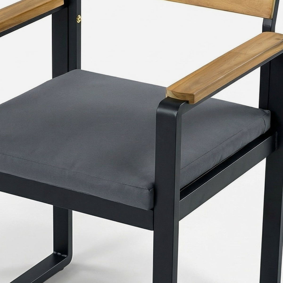 close-up of the armchair cushion and rounded acacia armrest