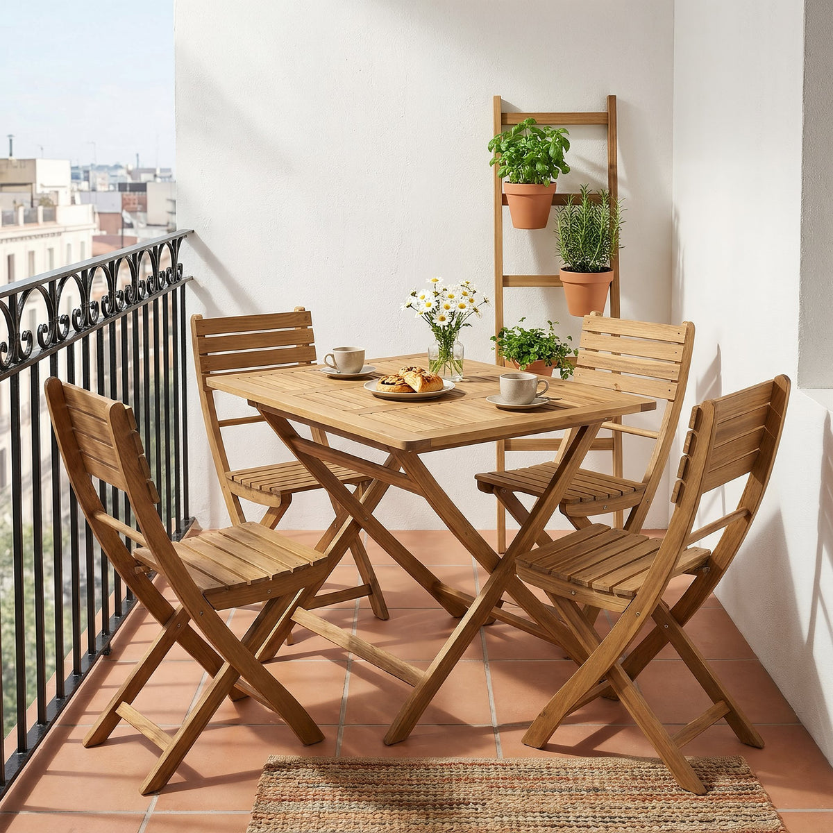 Acacia wood folding dining set with four chairs on a sunny city balcony with terracotta tiles and herbs