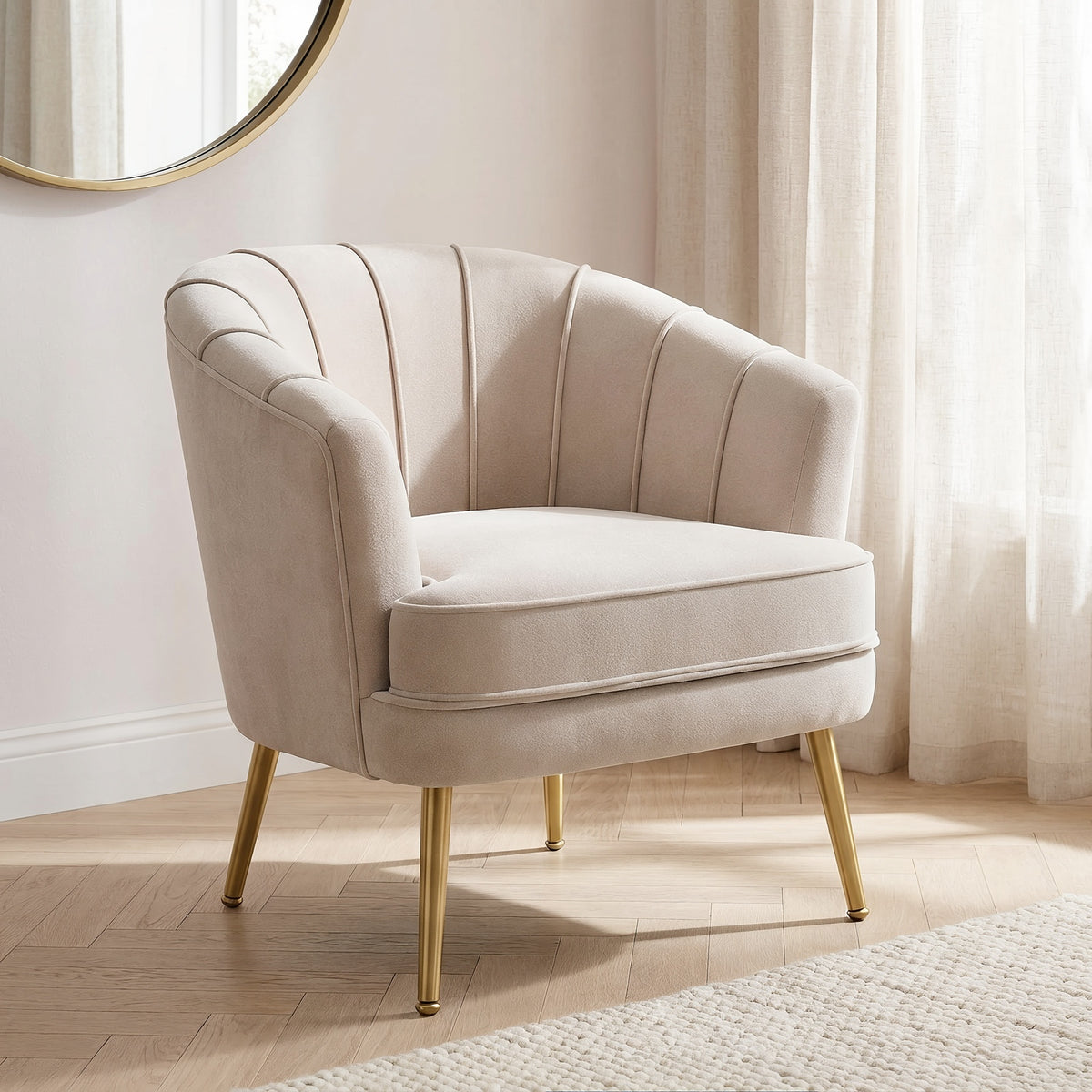 Beige velvet channel back accent chair with gold legs in a sunlit bedroom nook, closer three-quarter view