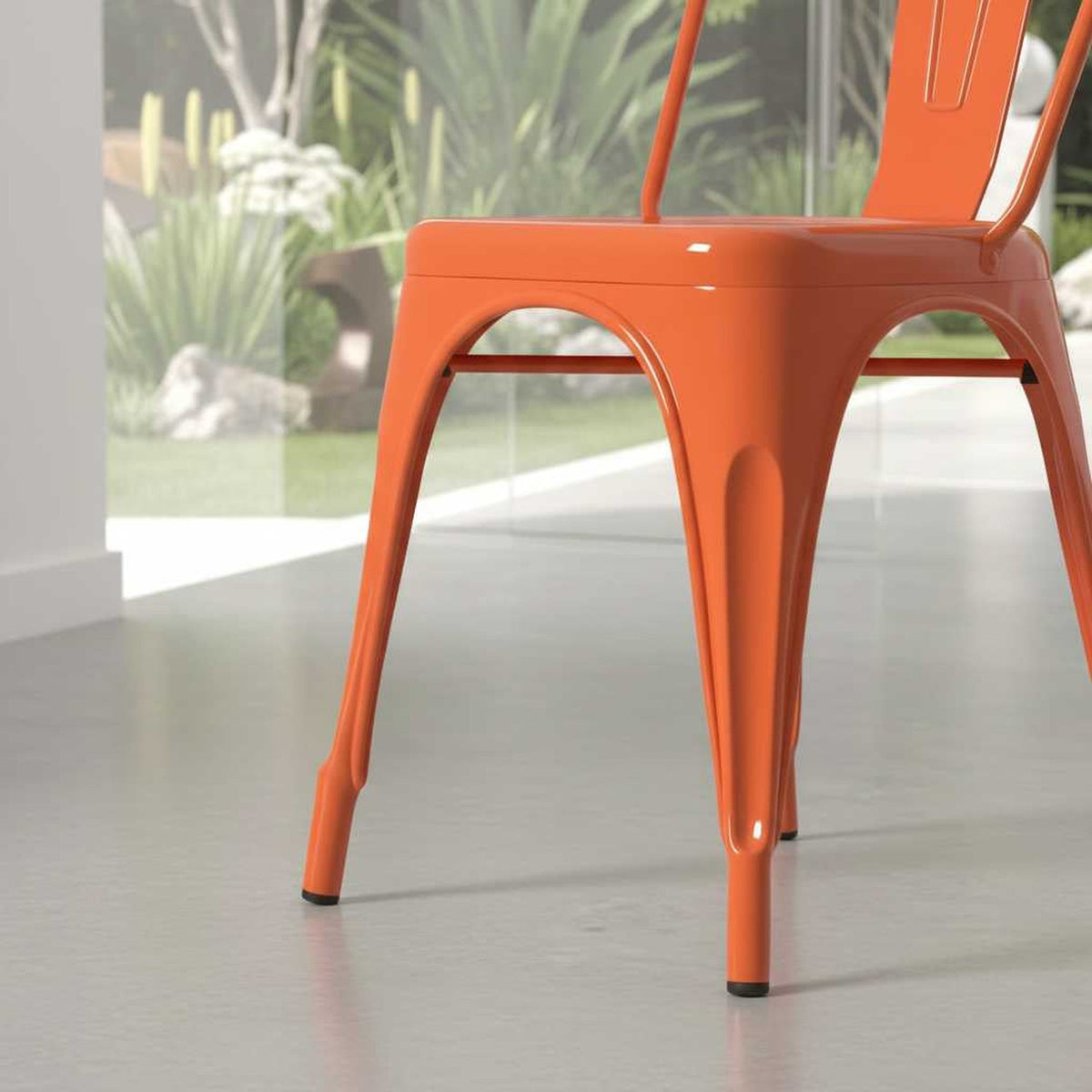 Vibrant rust metal dining chair with stackable design for small spaces (close-up detail)
