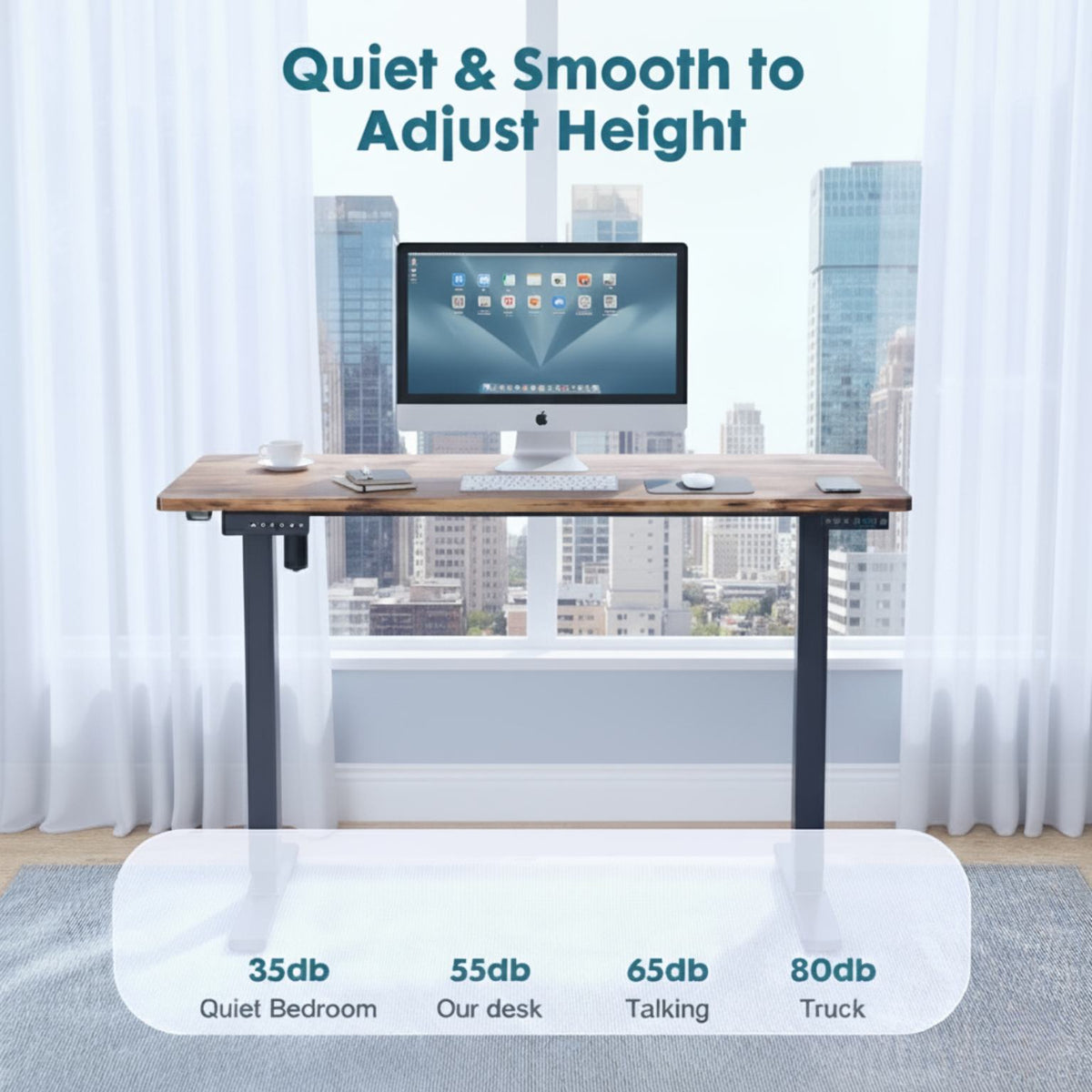 Adjustable height desk with a computer monitor in a room with large windows (feature callout)