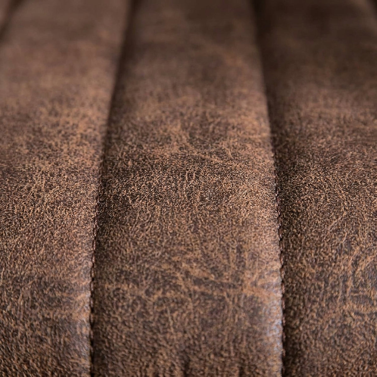 Close-up of the channel-stitched faux suede shell (close-up detail)