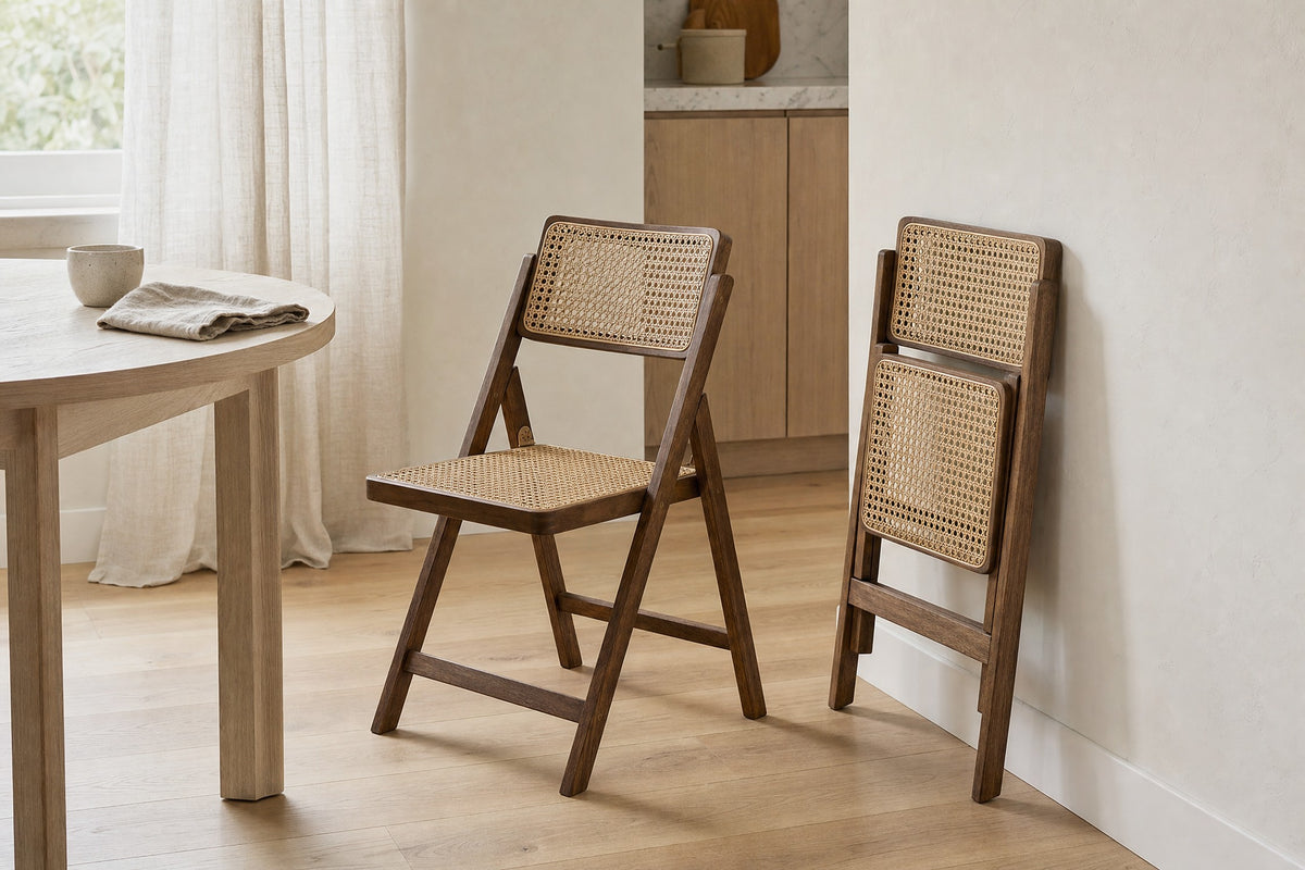 The chairs, one open and one folded flat against the wall in a kitchen