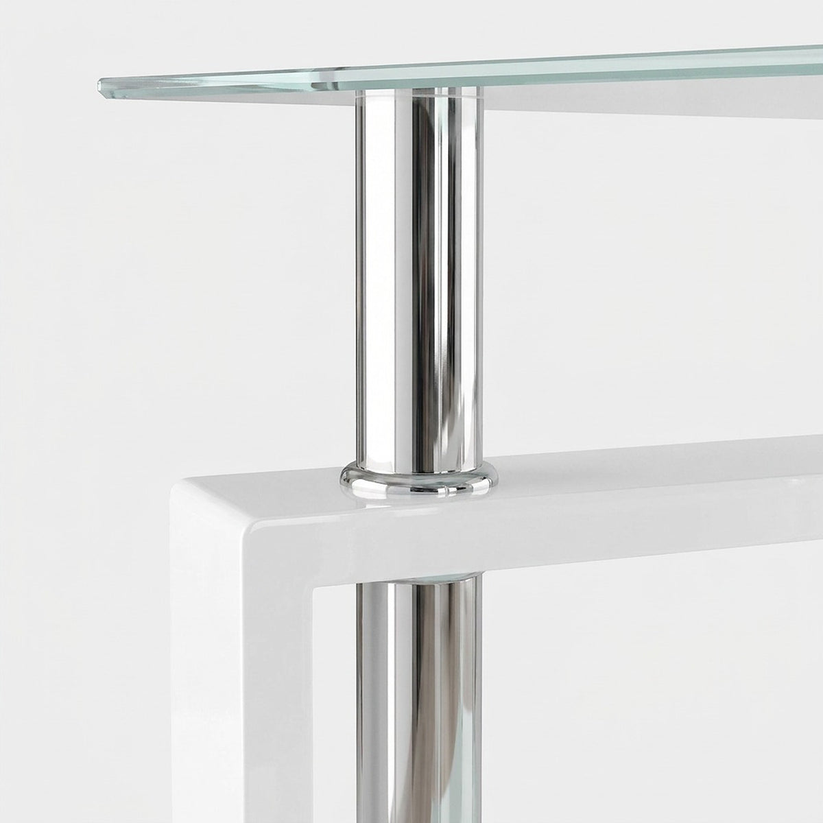 Close-up of a polished chrome post between the glass top and the white frame of a glass end table