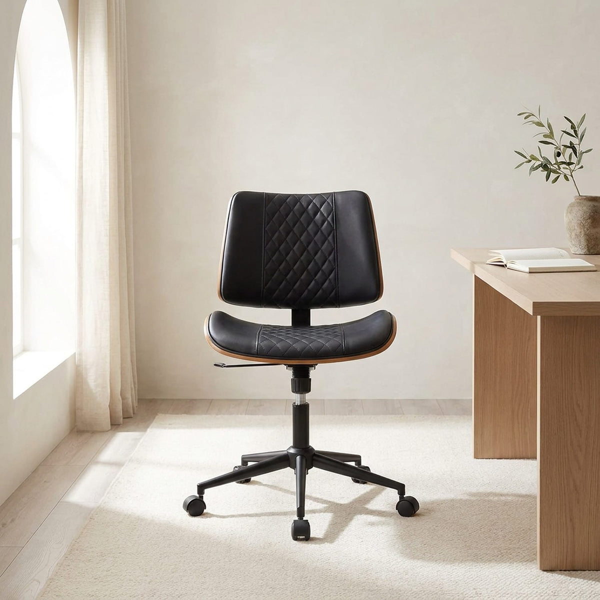 MCM office chair in a bright limewash room beside a wooden desk