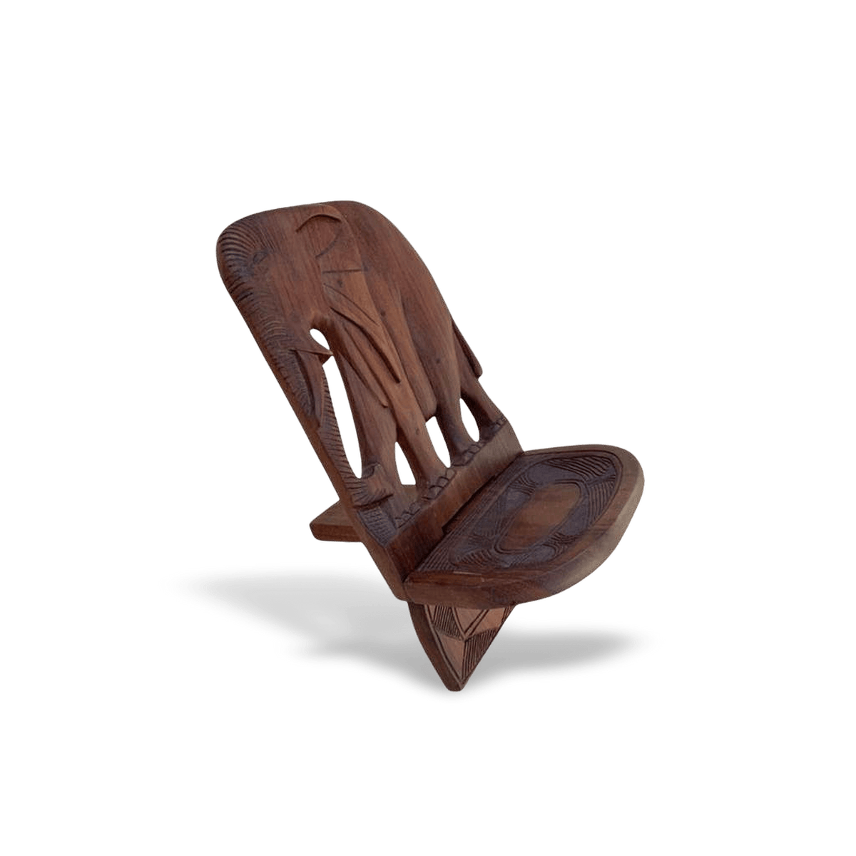 Handcrafted African wood accent stool, hand-carved from solid wood, shown against a #f3f3f3 studio backdrop.