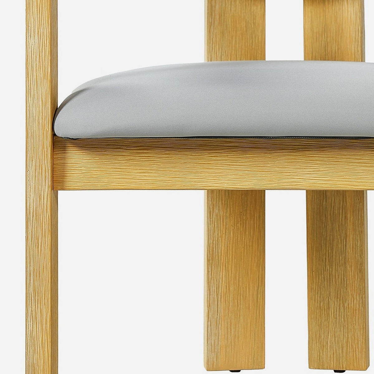 Fixed grey seat pad resting on an acacia seat apron (close-up detail)