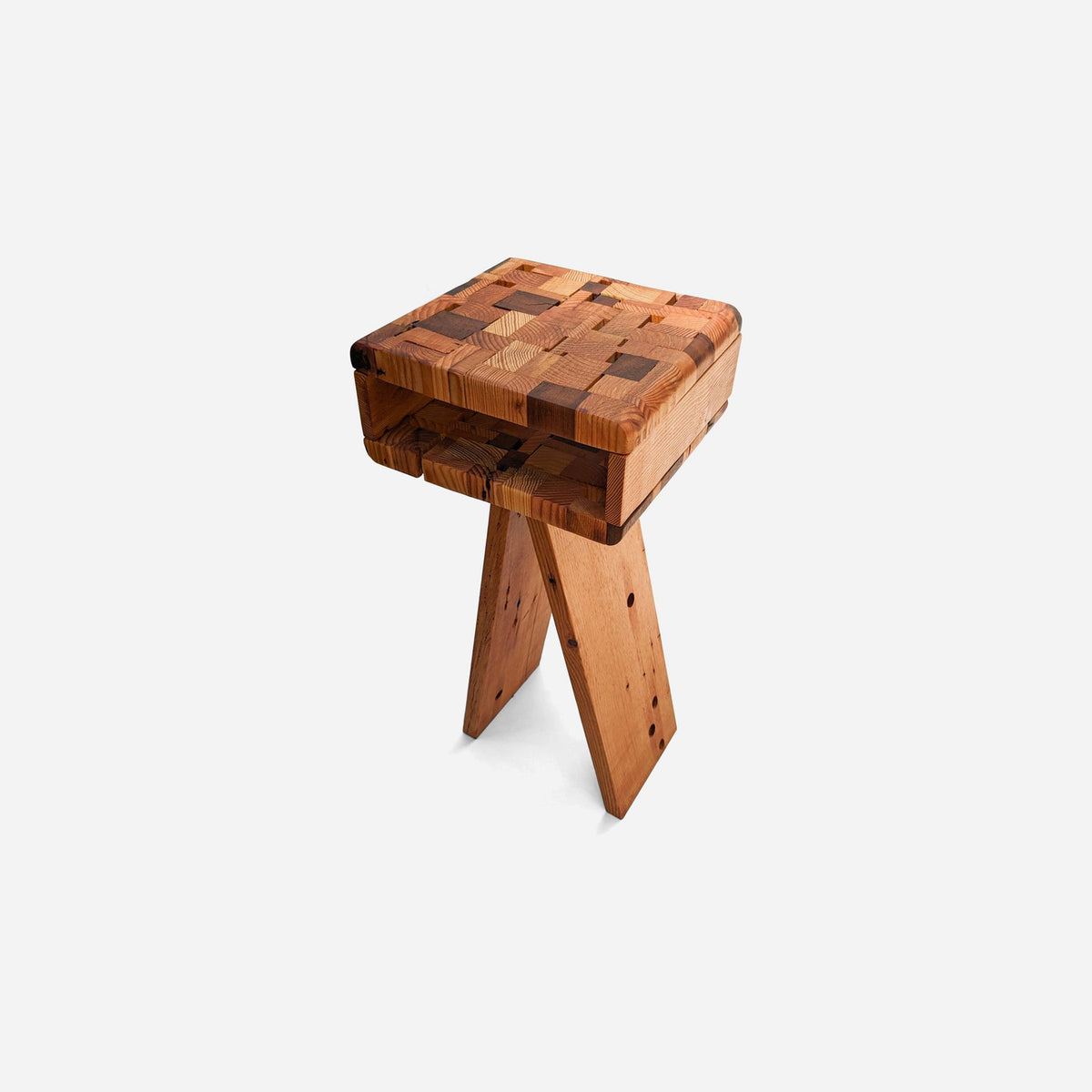 Narrow solid wood nightstand in patchwork fir with an open compartment, angled view
