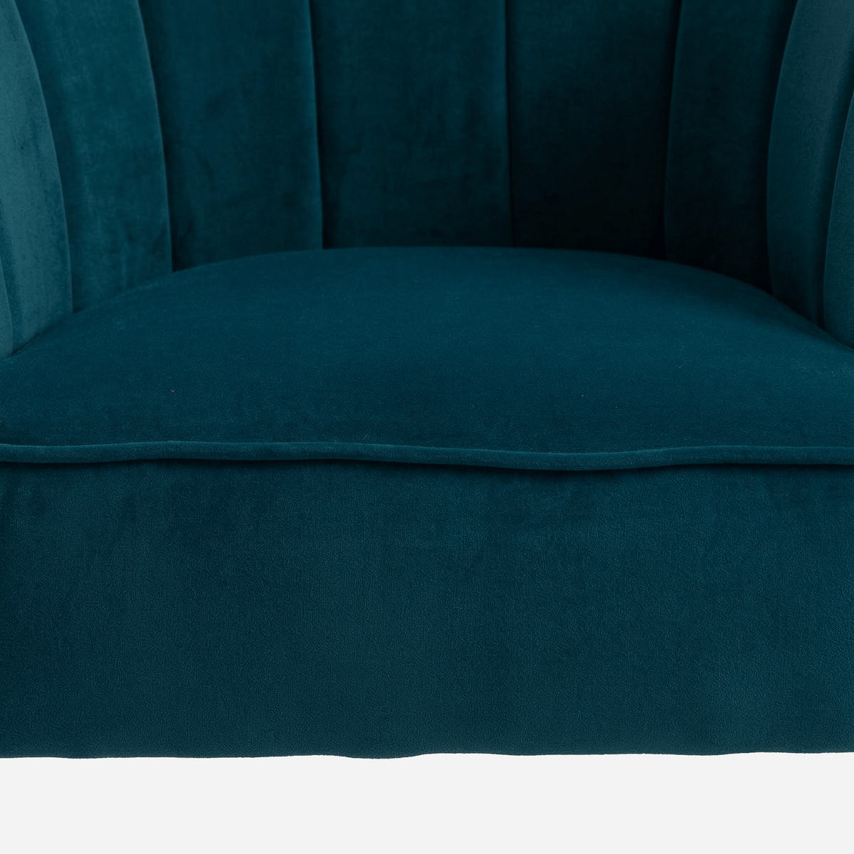 Plush piped teal velvet seat of the barrel chair (close-up detail)