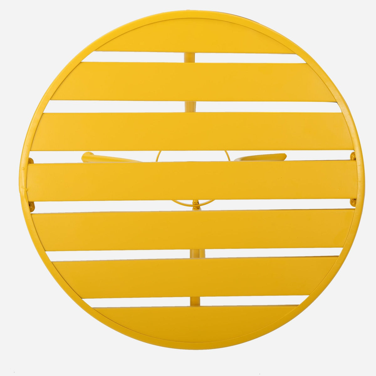 Flat yellow metal slats with narrow gaps on the round table top (close-up detail)