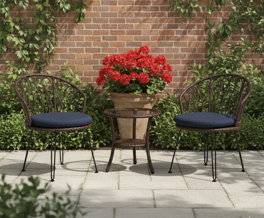 Two-chair outdoor bistro set with a small round table in front of a brick wall and greenery