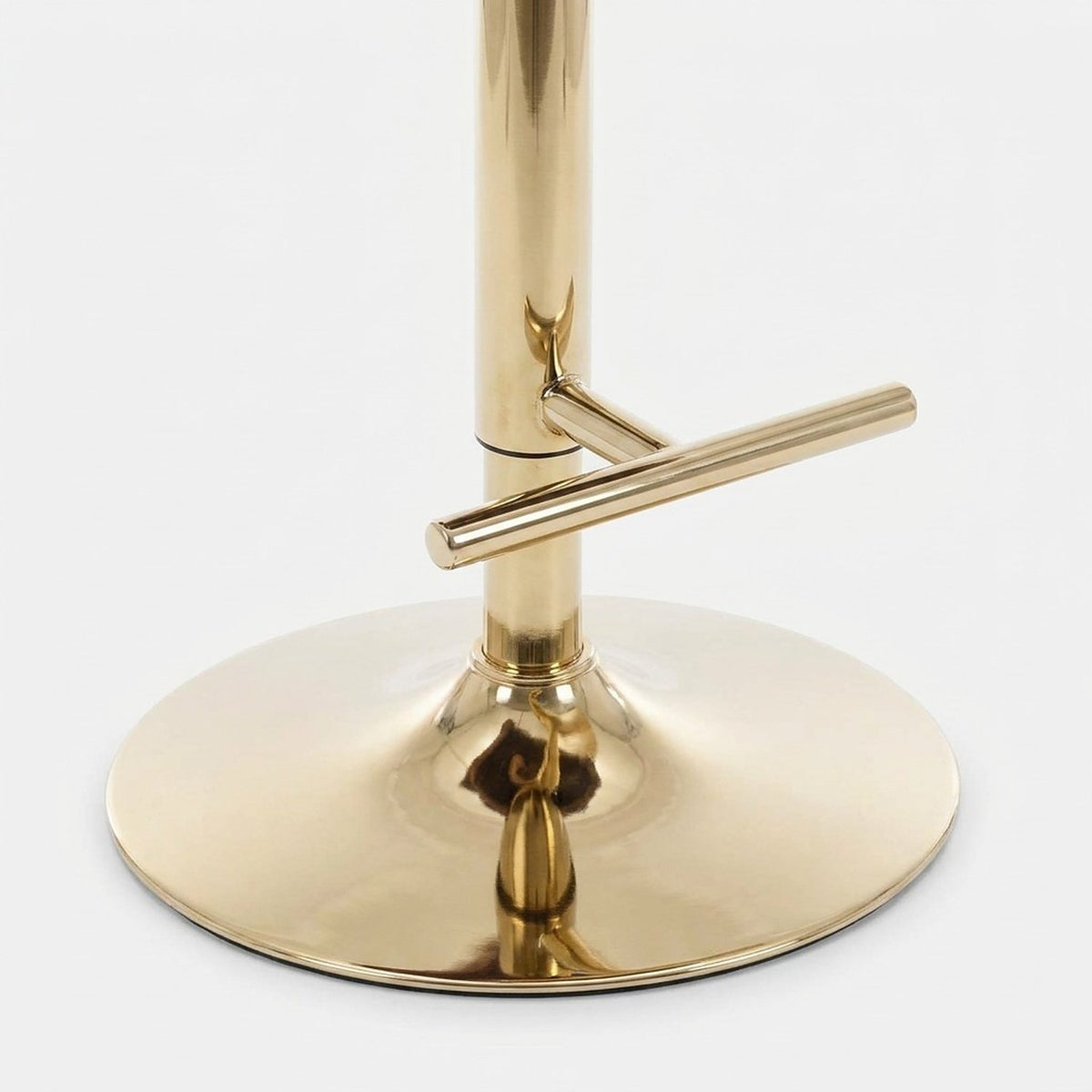 Gold-finish pedestal base and footrest bar of the swivel bar stool
