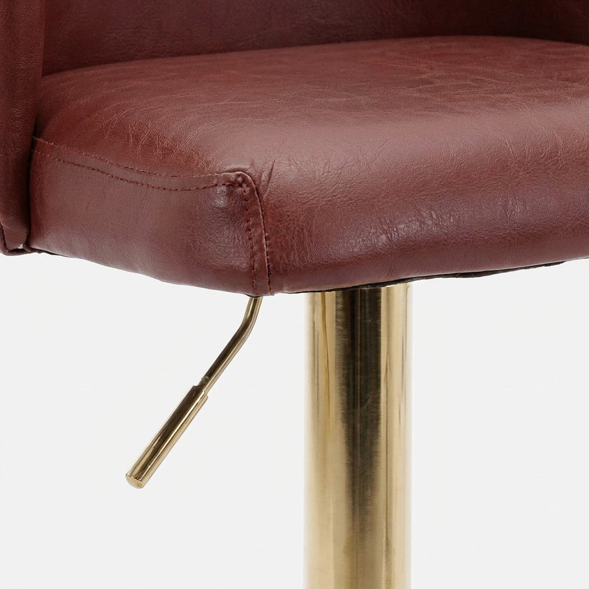 Stitched seat edge and height adjustment lever under the stool seat