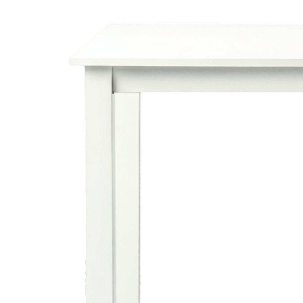 Thick lacquered top meeting the steel leg at the left corner (close-up detail)