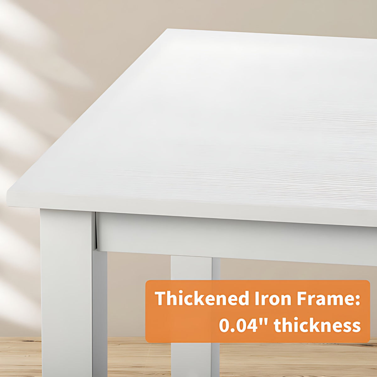 White table with a thickened iron frame label on a neutral background (feature callout)