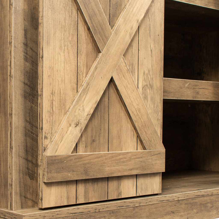Walnut-finish rustic TV stand with sliding barn door and X-brace detail.