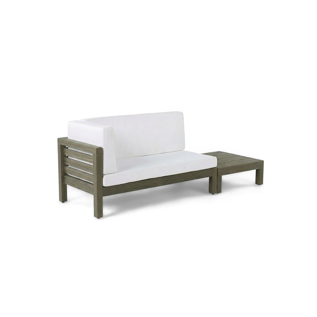 Acacia wood loveseat set with white cushions and matching slatted coffee table, three-quarter view (plain studio)