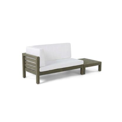 Acacia wood loveseat set with white cushions and matching slatted coffee table, three-quarter view (plain studio)