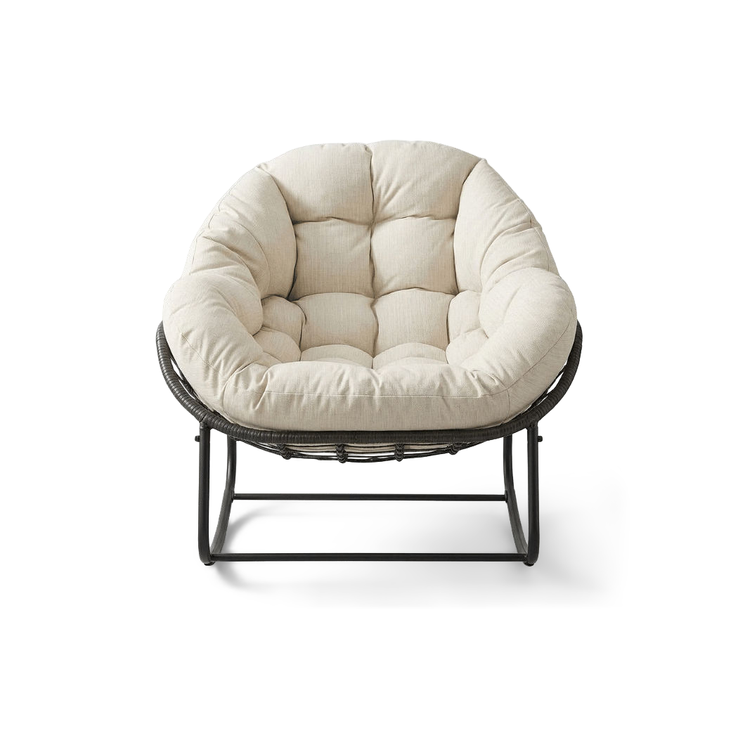 Oversized papasan rocking chair with a cream padded cushion, front view (plain studio)