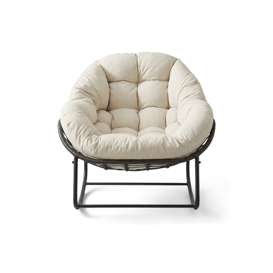 Oversized papasan rocking chair with a cream padded cushion, front view (plain studio)