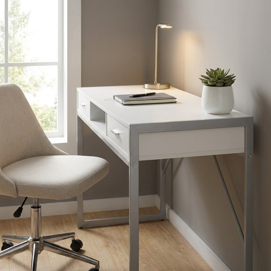 White silver metal computer desk styled by a window