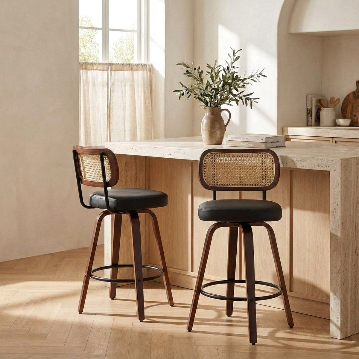 Closer view of a swivel rattan counter stool at a kitchen island
