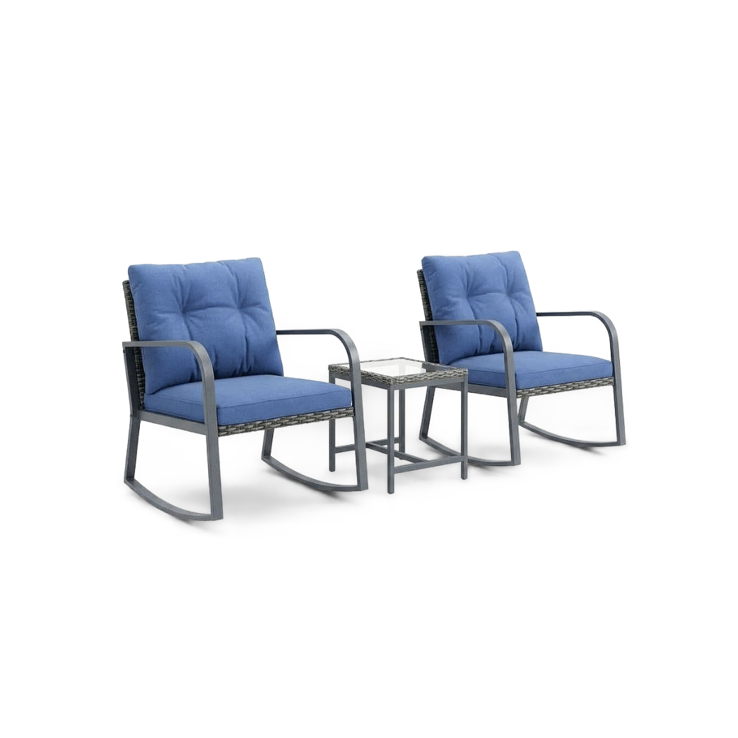 Blue-cushioned steel rocking chairs with a glass-top wicker side table, angled view, studio background (plain studio)