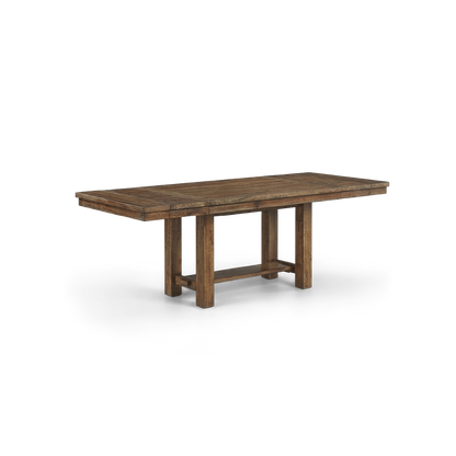 Extension dining table with a planked top in a distressed nutmeg finish