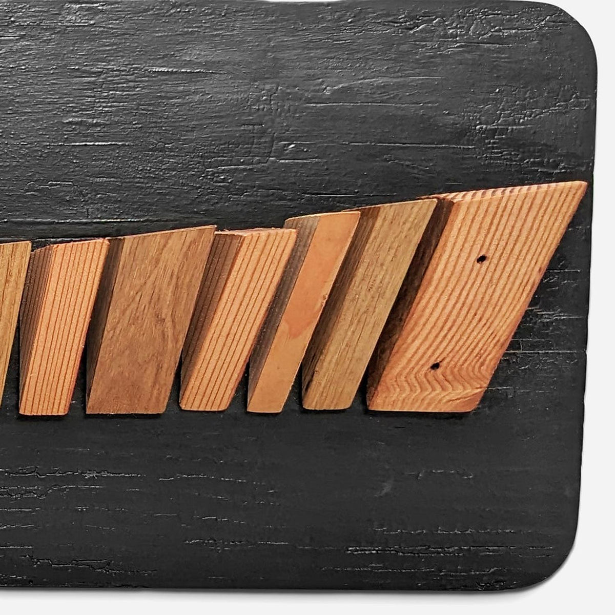 Close-up of open fir grain and nail holes on the block faces