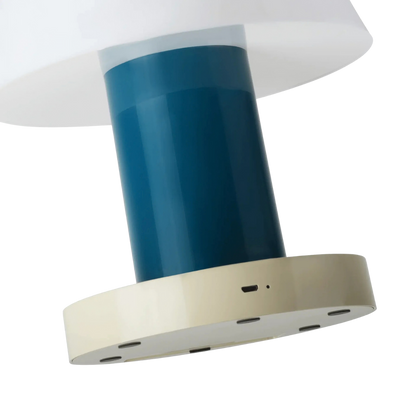 Close-up detail of the USB charging port and status LED on the base rim (close-up detail)