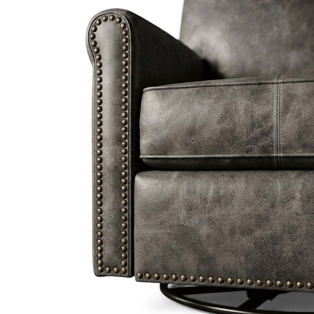 Close-up of the rolled arm with brass nailhead trim and stitched seat cushion (close-up detail)