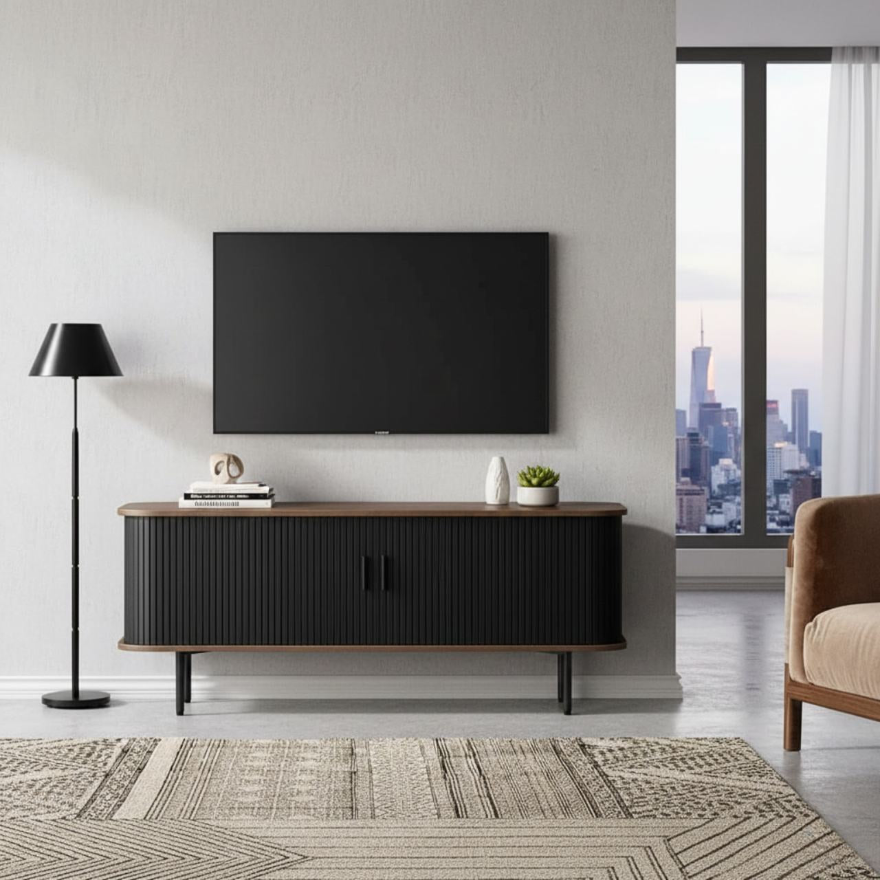 47-inch black TV stand with sliding doors and storage beneath a wall-mounted TV in a modern living room.