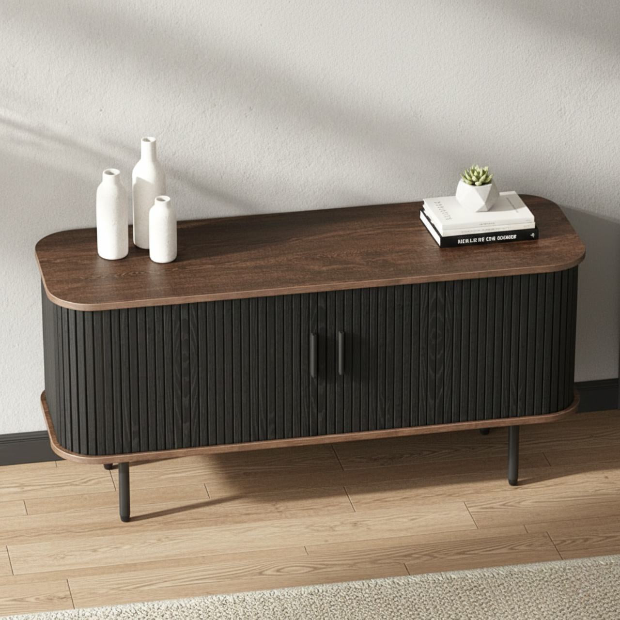 47-inch black sliding-door TV stand with curved wood top, vertical slat doors, and slender legs.