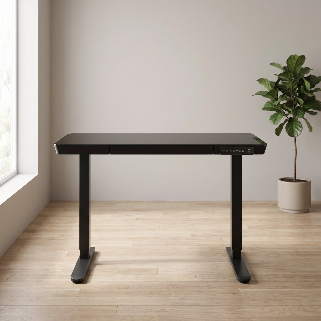 48 inch glass electric standing desk in a home office setting, front angle