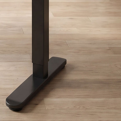 48 inch glass electric standing desk, rear leg and foot detail in a home office