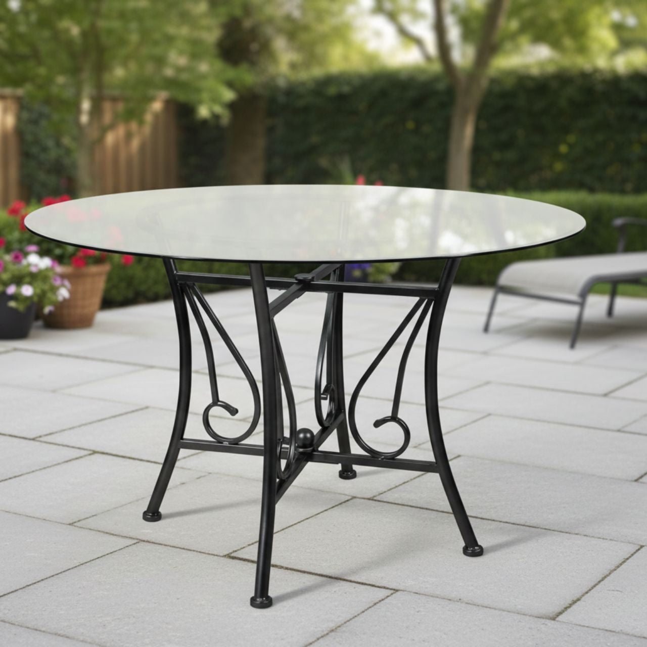 48-inch Round Glass Dining Table with black metal pedestal frame and 8mm tempered glass top, outdoor patio setting.