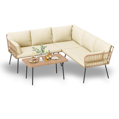 Beige sectional sofa with wicker armrests and a matching coffee table on a white background