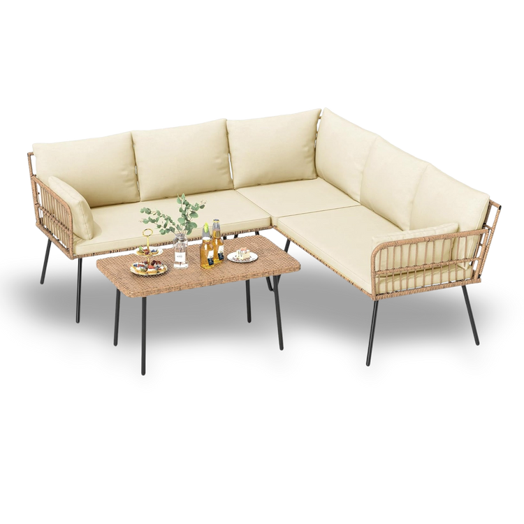 Beige sectional sofa with wicker armrests and a matching coffee table on a white background