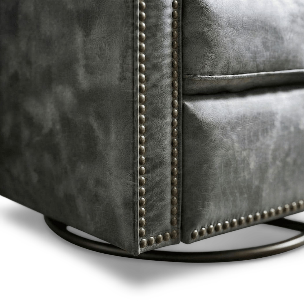 Close-up of the nailhead trim and round metal swivel base (close-up detail)