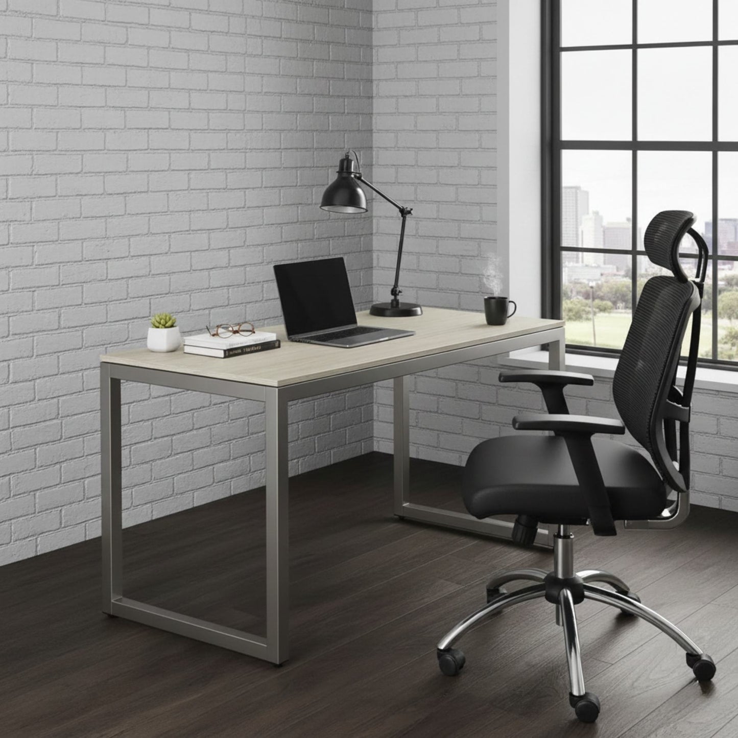 55-Inch Maple Computer Desk With Grommets And Glides in a modern home office with laptop, lamp, mug, and plant
