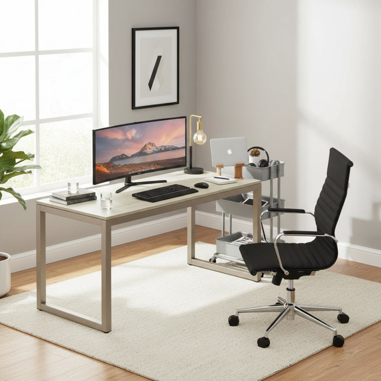 55-inch maple computer desk with grommets and glides in a modern home office setup with monitor, keyboard, and laptop.
